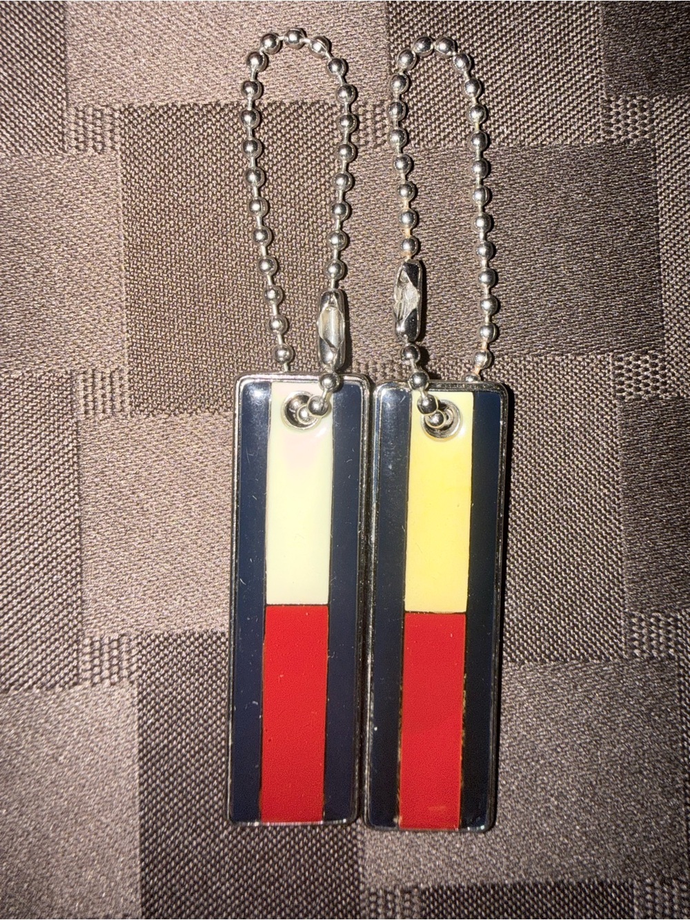 A pair of Vintage Tommy Hilfiger Logo Enamel Keychain